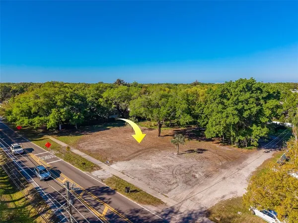 a view of a swimming pool with an outdoor seating and a garden