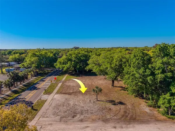 a view of a swimming pool with a yard and lake view