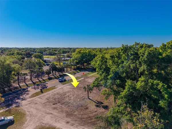 a view of a swimming pool with lawn chairs