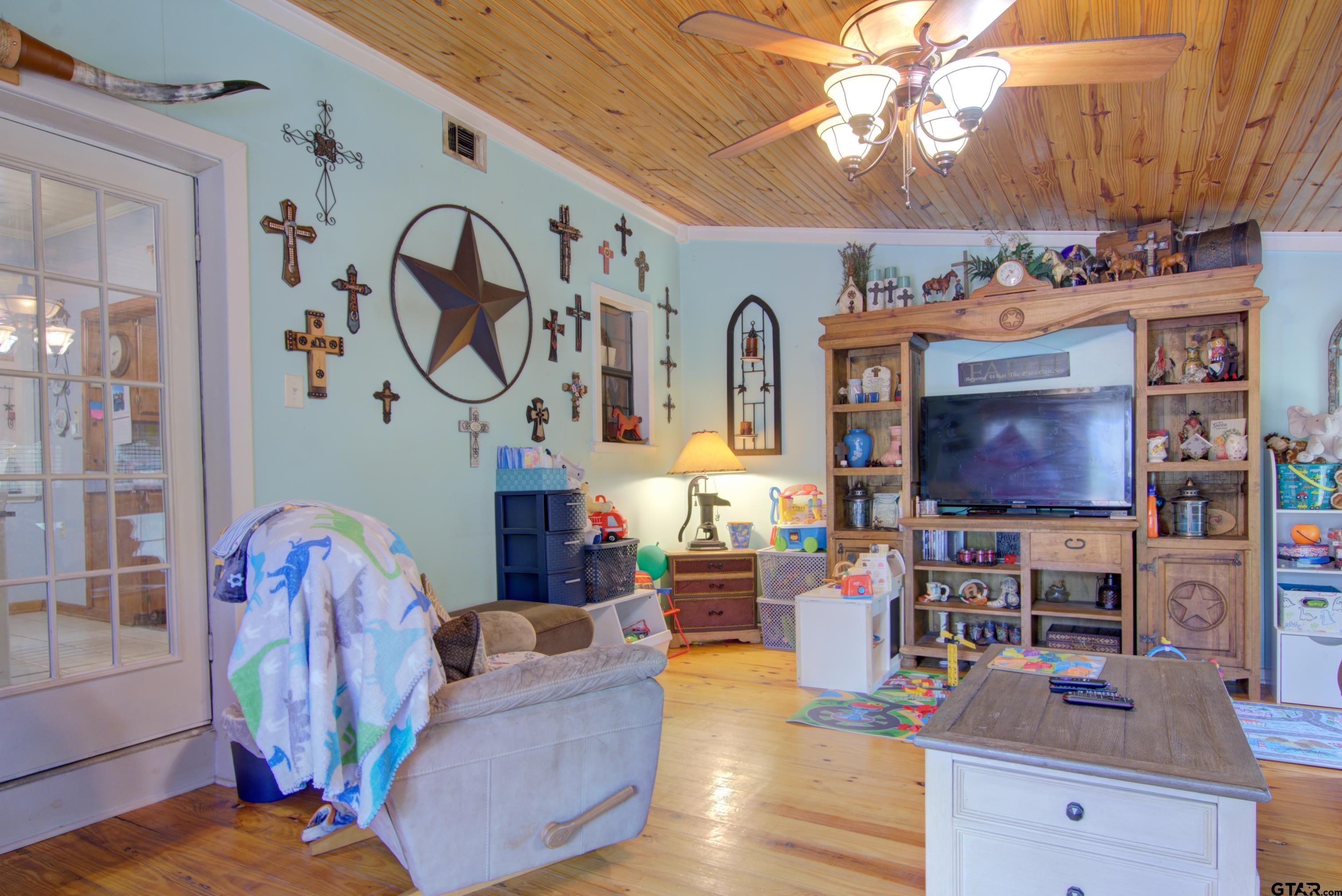 9315 Farm To Market Road 851 Rusk, TX 75785 - Photo 12 of 34 a living room with furniture and wooden floor