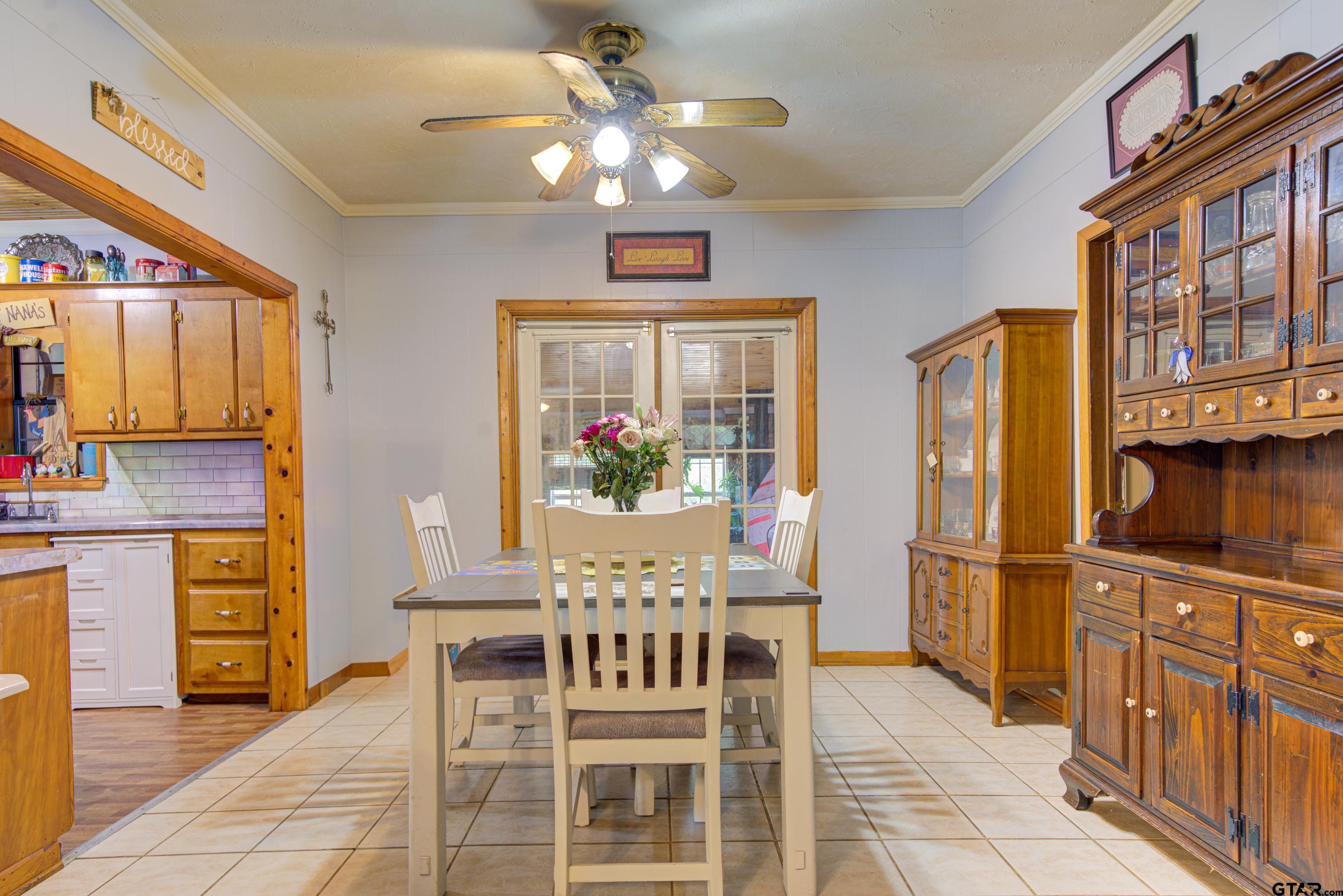 9315 Farm To Market Road 851 Rusk, TX 75785 - Photo 17 of 34 a view of a dining room with furniture window and wooden floor