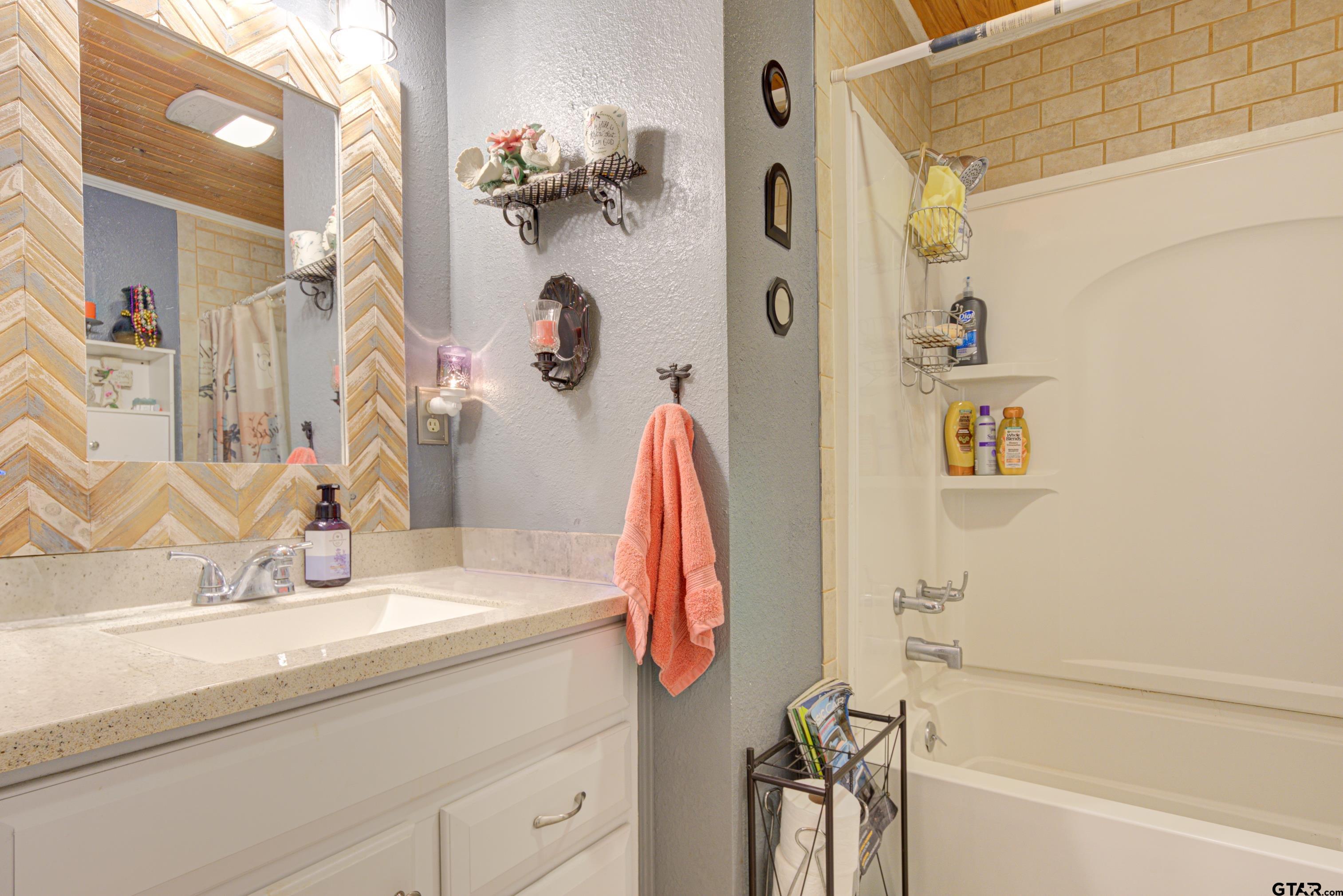 9315 Farm To Market Road 851 Rusk, TX 75785 - Photo 22 of 34 a bathroom with a sink and a mirror