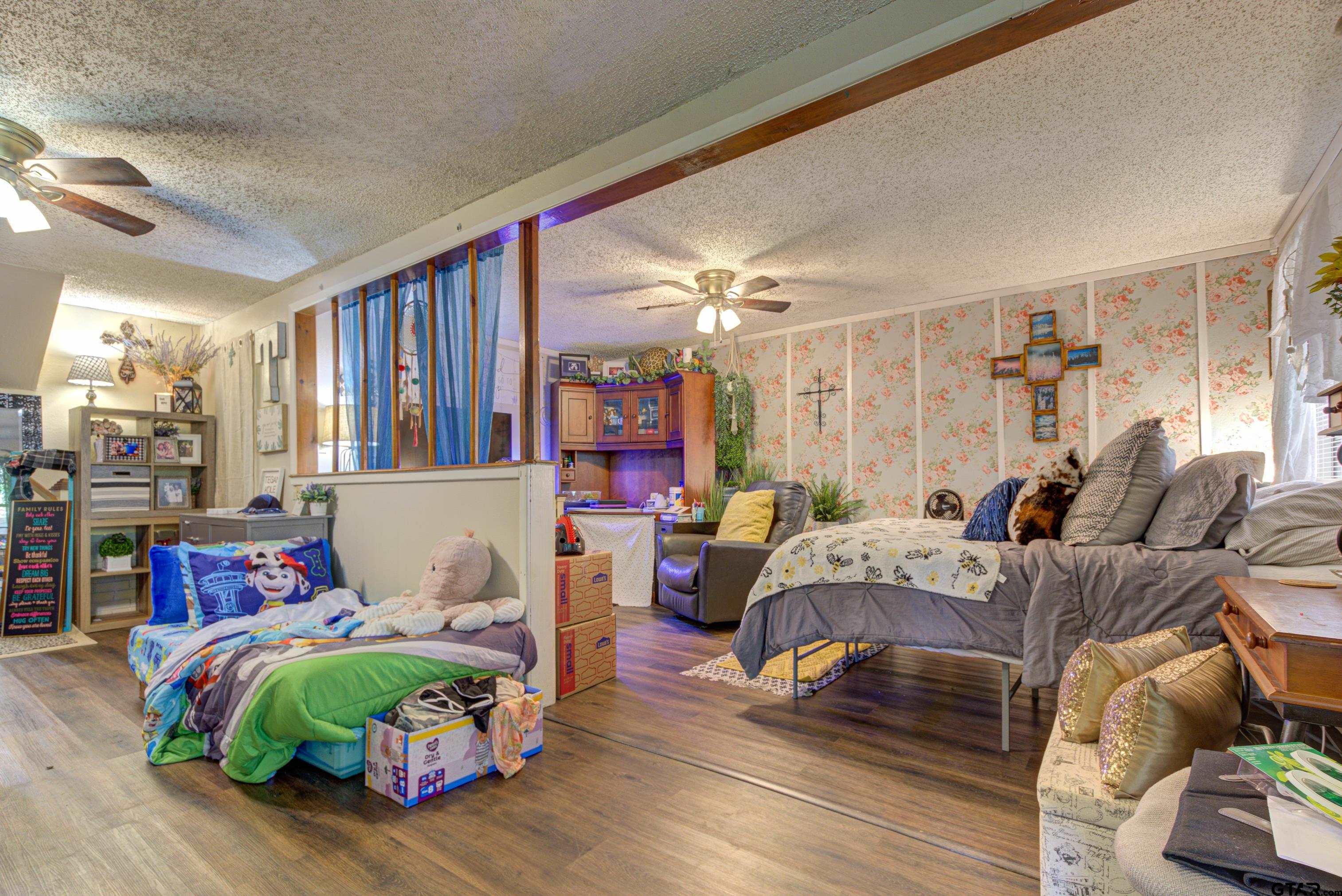 9315 Farm To Market Road 851 Rusk, TX 75785 - Photo 24 of 34 a living room with furniture and a wooden floor