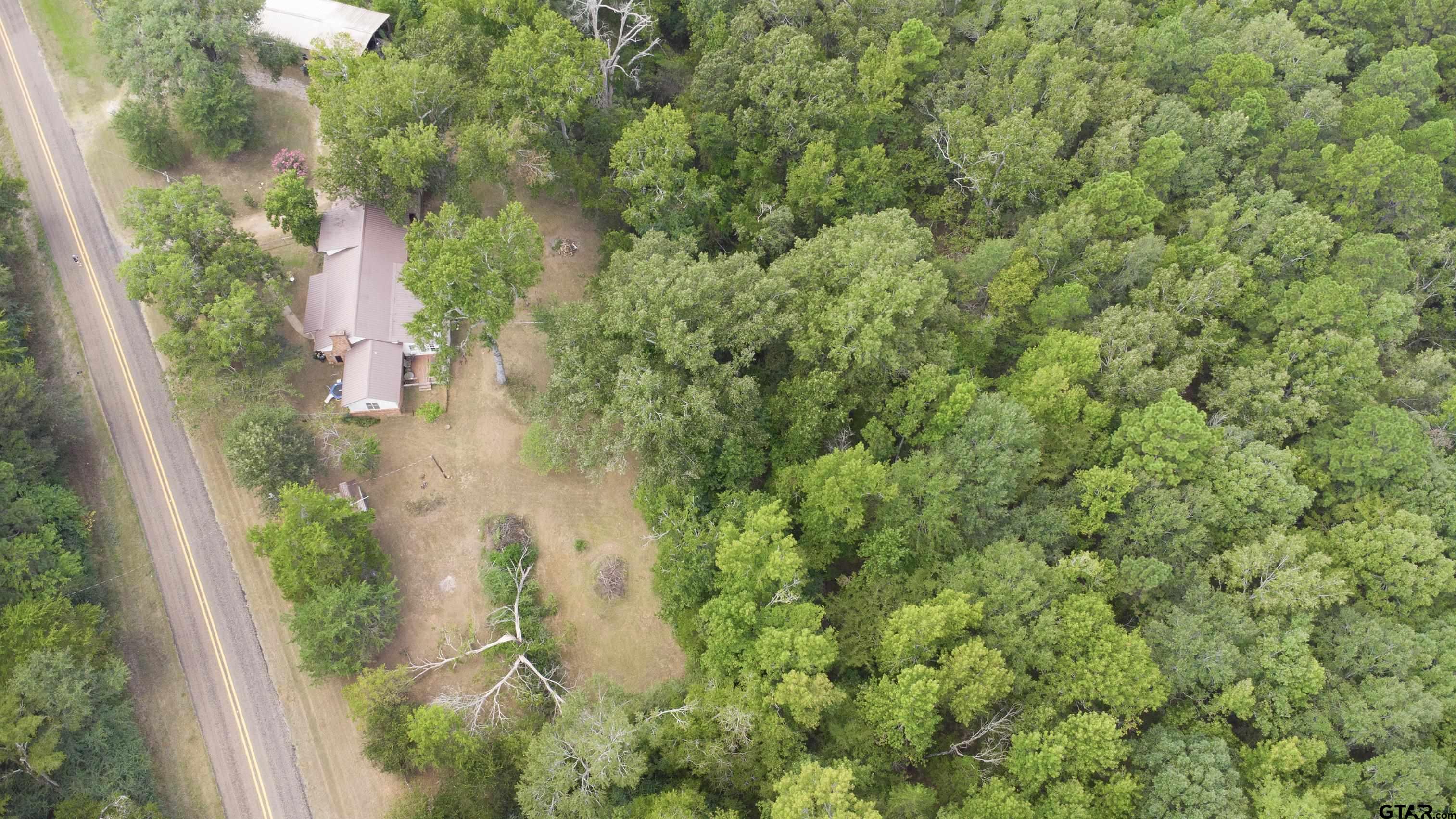 9315 Farm To Market Road 851 Rusk, TX 75785 - Photo 5 of 34 an aerial view of residential house with outdoor space and trees all around
