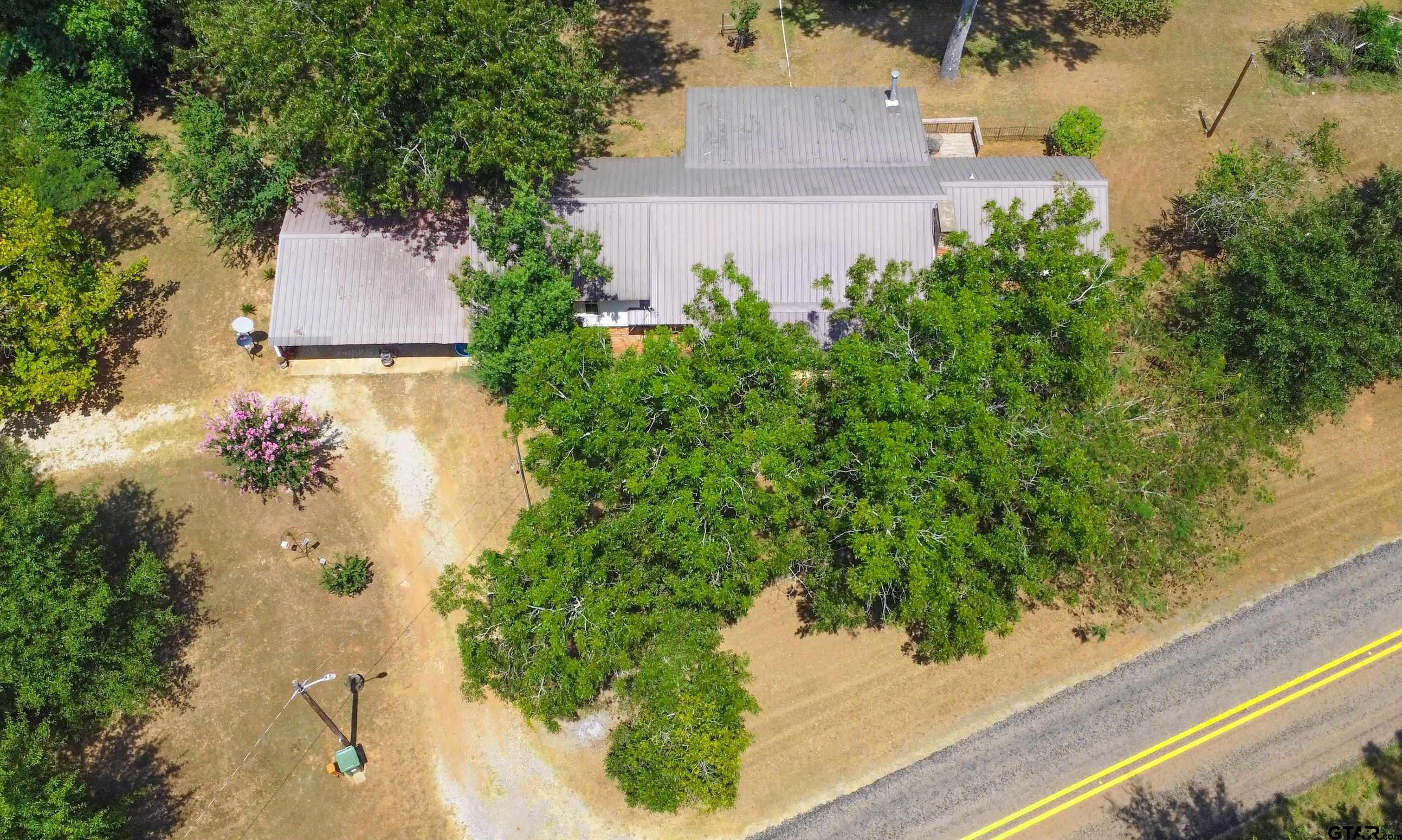 9315 Farm To Market Road 851 Rusk, TX 75785 - Photo 6 of 34 an aerial view of a house with a yard