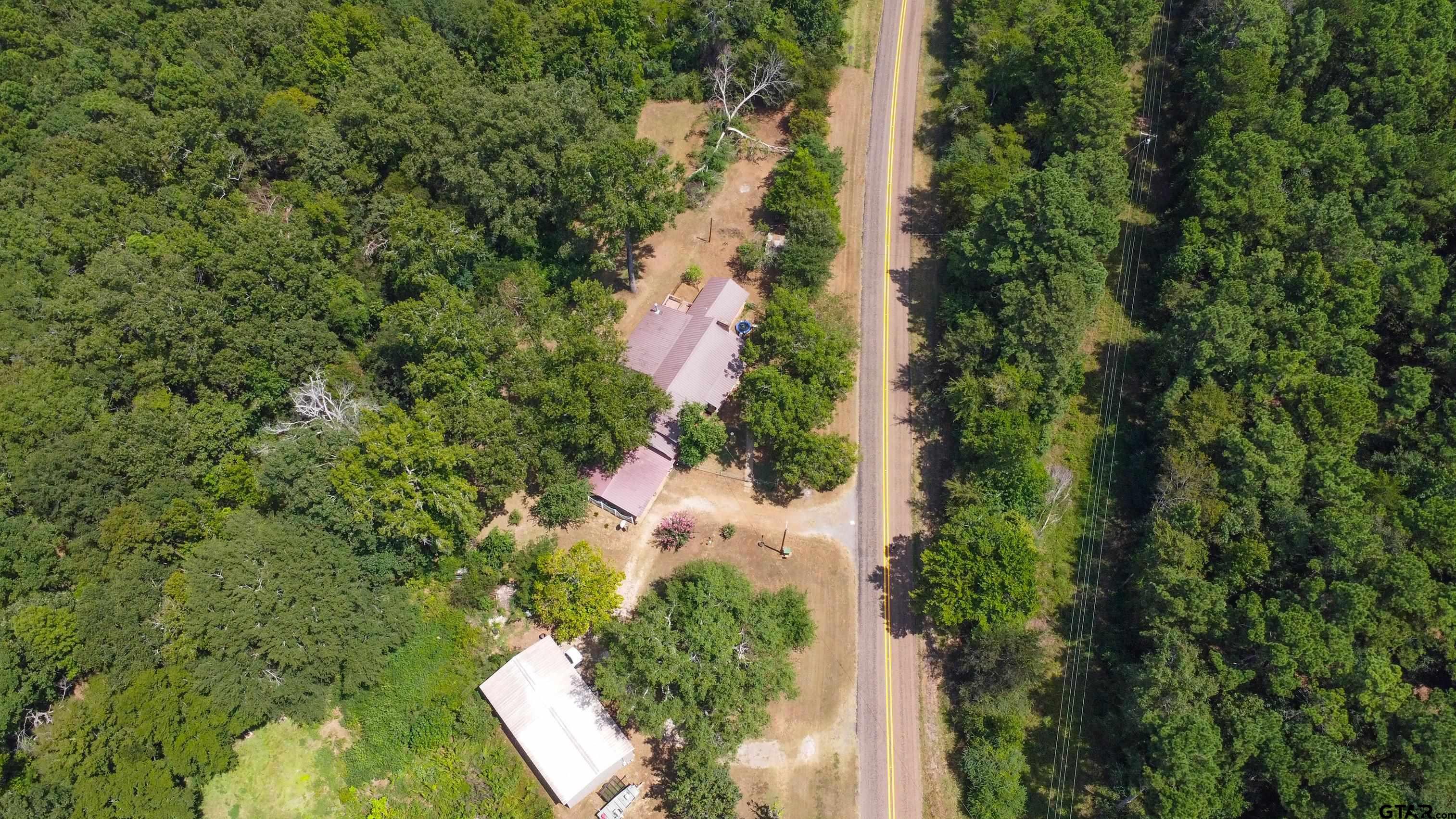 9315 Farm To Market Road 851 Rusk, TX 75785 - Photo 7 of 34 an aerial view of residential house with outdoor space and trees all around