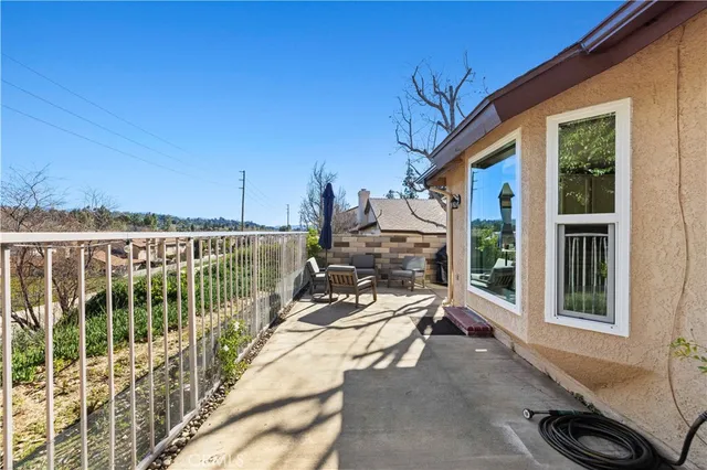 a view of a balcony with chairs