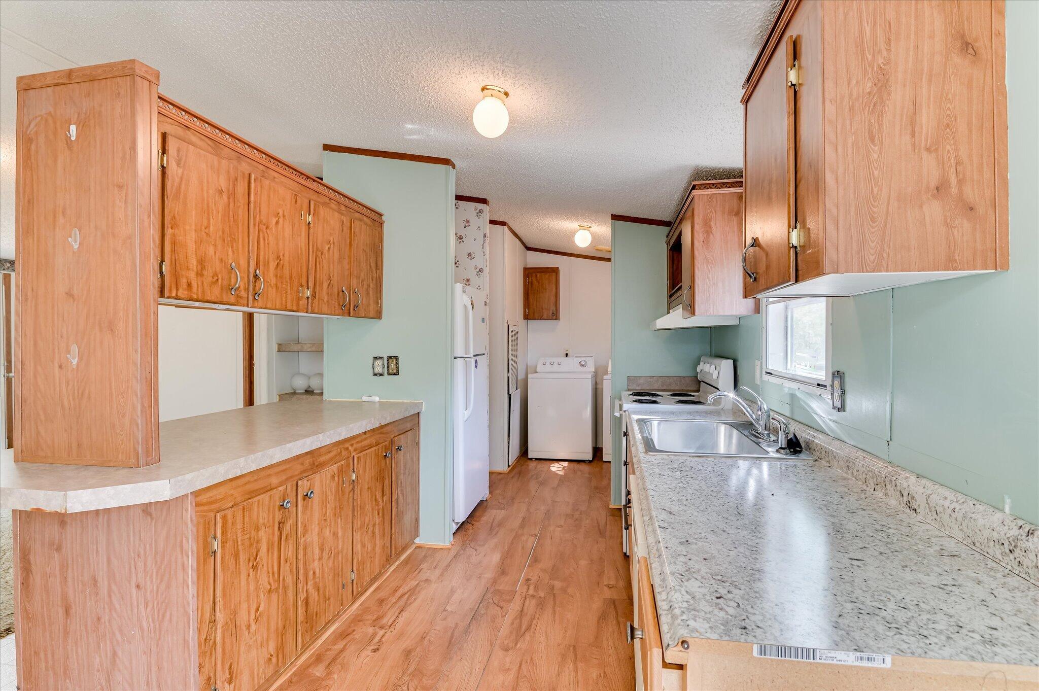 3440 Smith Road Blythe, GA 30805 - Photo 16 of 32 Kitchen with view of laundry room