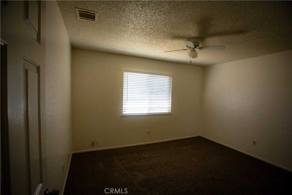 21090 Lone Eagle Road Apple Valley, CA 92308 - Photo 7 of 11 an empty room with a window