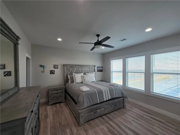 a view of a hallway view with wooden floor and staircase