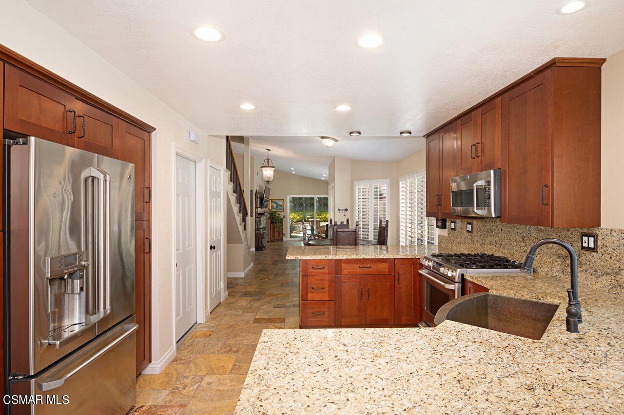 777 Congressional Road Simi Valley, CA 93065 - Photo 15 of 26 a kitchen with granite countertop a refrigerator and a sink