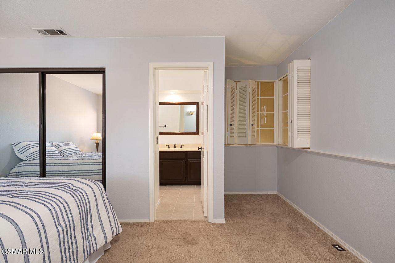 777 Congressional Road Simi Valley, CA 93065 - Photo 17 of 26 a bedroom with a bed and a mirror