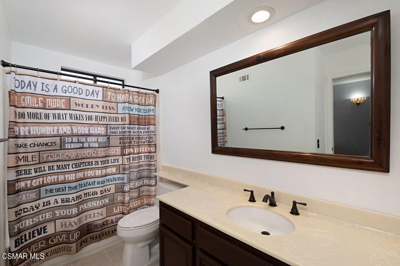 777 Congressional Road Simi Valley, CA 93065 - Photo 18 of 26 a bathroom with a sink toilet and shower