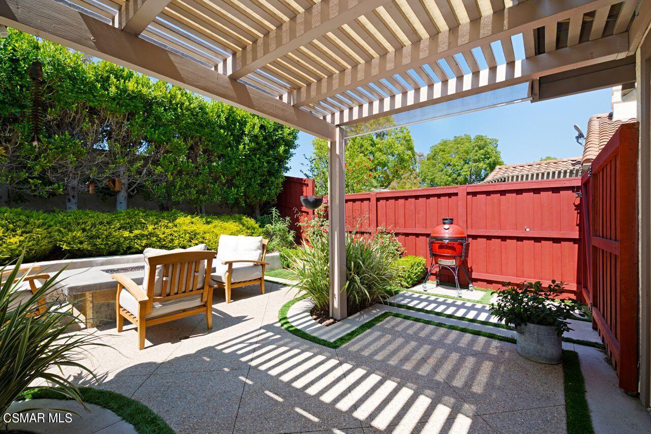 777 Congressional Road Simi Valley, CA 93065 - Photo 20 of 26 a view of a patio with table and chairs potted plants with wooden floor
