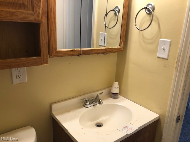20916 Franklin Road Maple Heights, OH 44137 - Photo 16 of 33 Bathroom with vanity and mirror