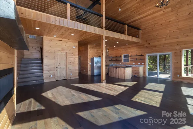 a view of an entryway with a table and chairs