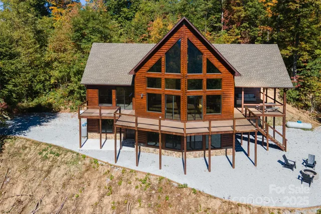 a view of house with swimming pool and sitting space