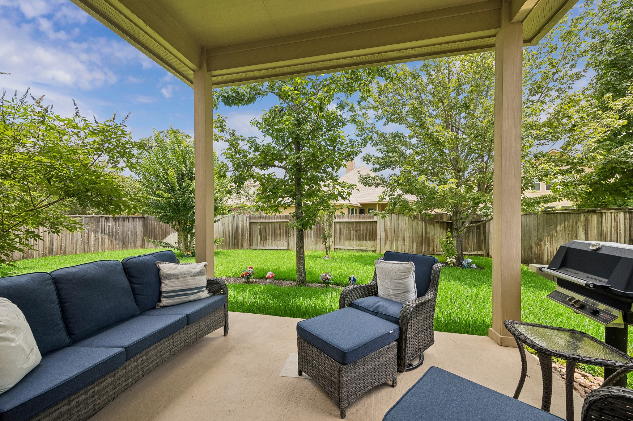 14 Tallgrass Way Spring, TX 77389 - Photo 29 of 31 Covered backyard sitting area perfect for relaxing, and enjoying the outdoors year-round.