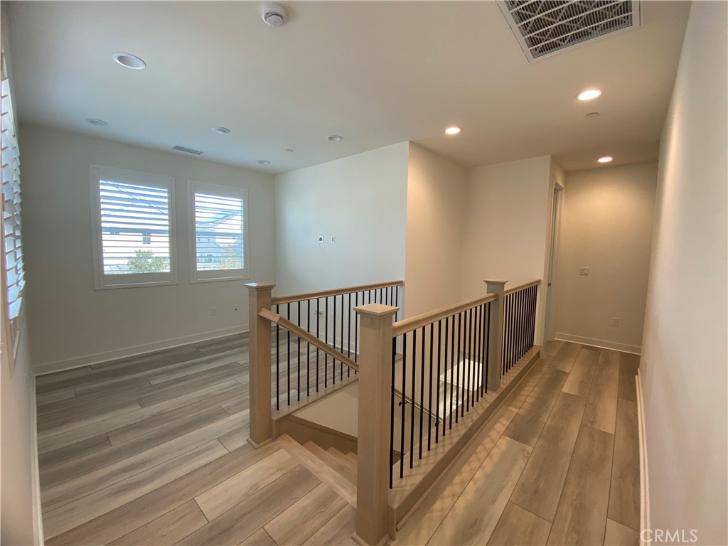 602 Jasper Street Rancho Mission Viejo, CA 92694 - Photo 9 of 18 a view of a hallway with windows