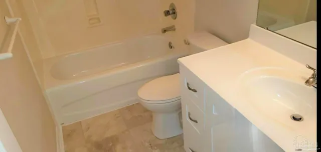 a bathroom with a sink a toilet and shower curtain