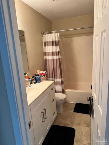 a view of a deck with a table and chairs