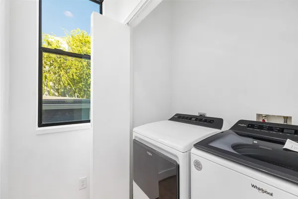 a bathroom with a toilet and a tub