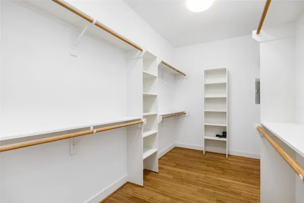 a view of a room with shelf on the wall