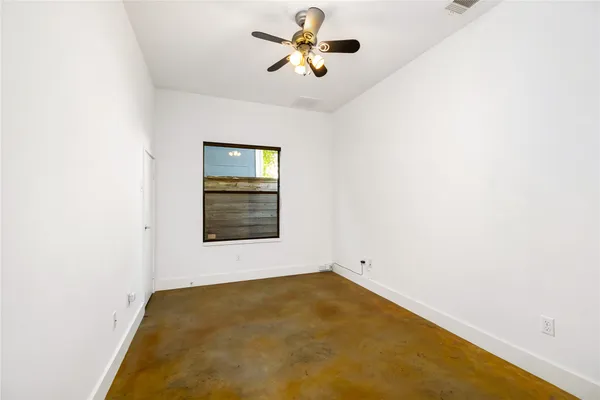 a view of a big room with carpet