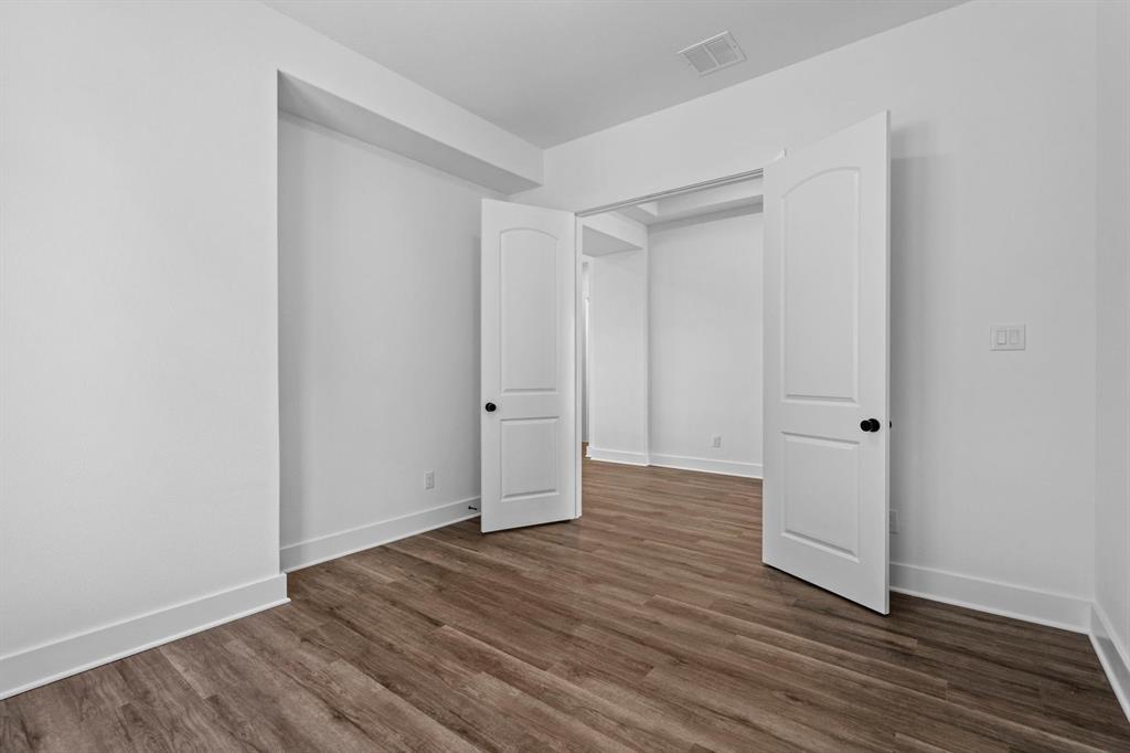 1792 Monarch Way Oak Point, TX 75068 - Photo 21 of 26 a view of wooden floor in an empty room