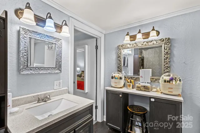 a bathroom with a sink double vanity and a mirror