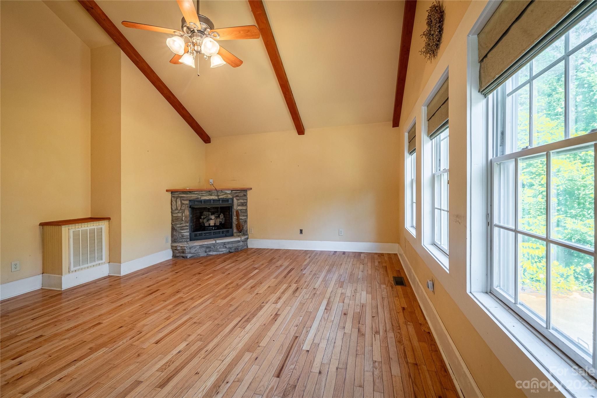 611 Vinearden Road Morganton, NC 28655 - Photo 11 of 32 a view of an empty room with wooden floor and a window