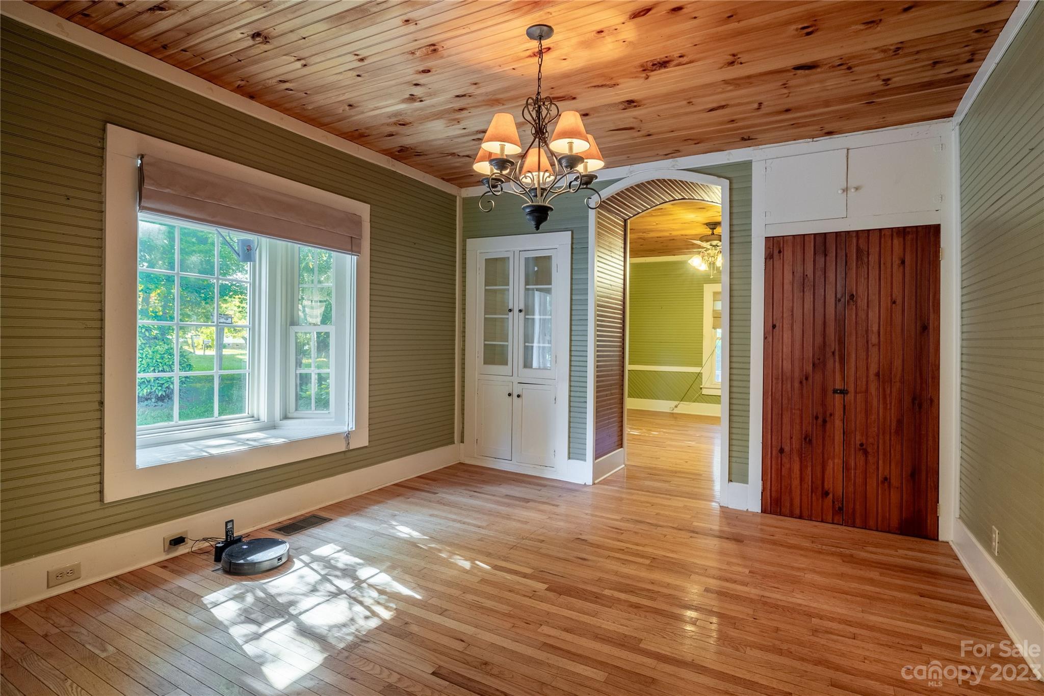 611 Vinearden Road Morganton, NC 28655 - Photo 13 of 32 a view of a room with wooden floor chandelier and windows