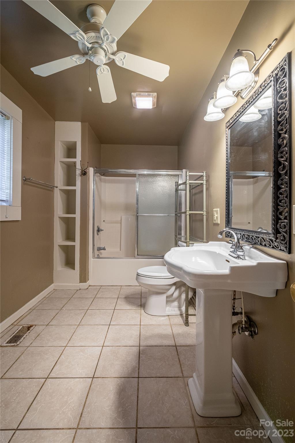611 Vinearden Road Morganton, NC 28655 - Photo 16 of 32 a kitchen with a sink a refrigerator and cabinets