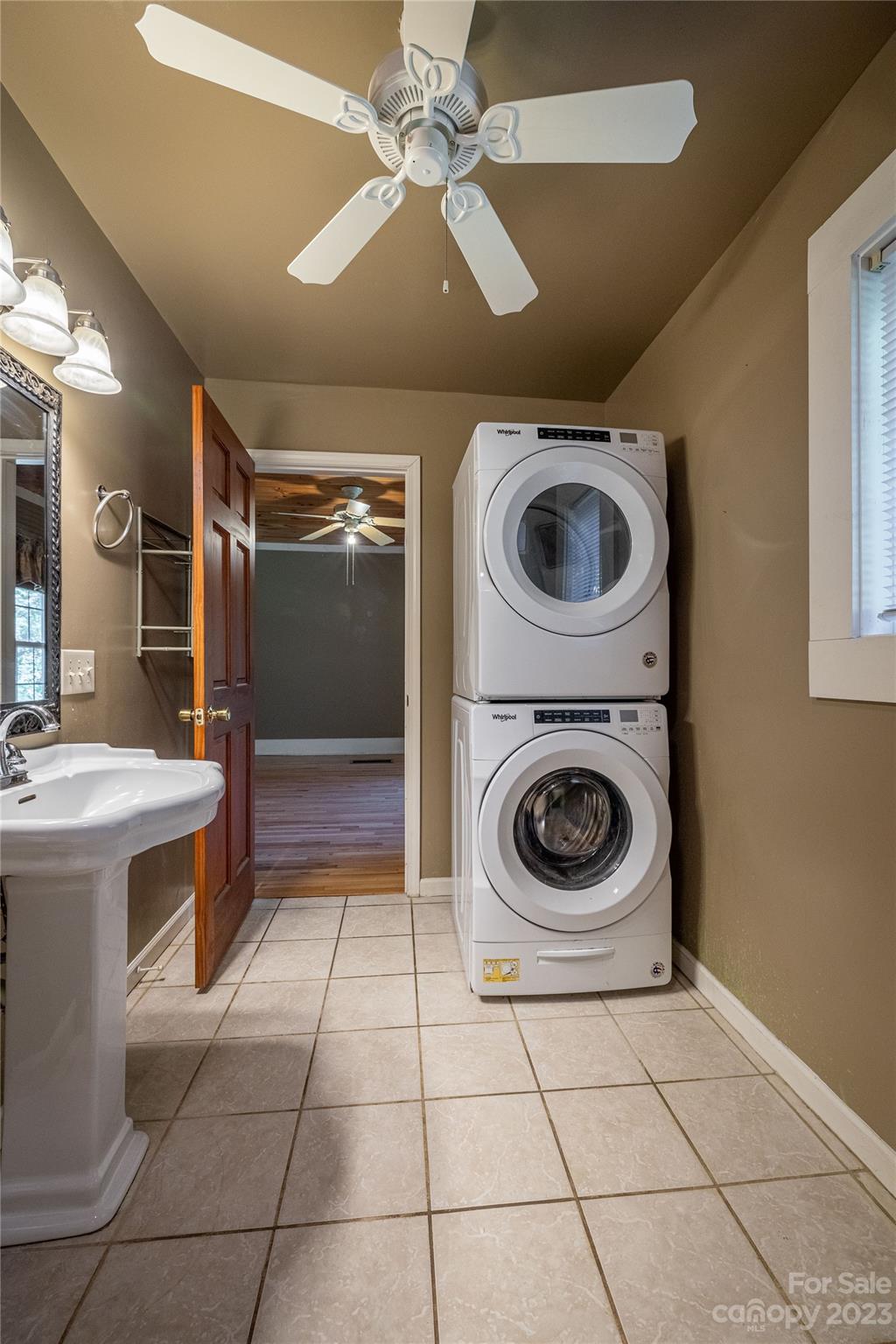 611 Vinearden Road Morganton, NC 28655 - Photo 17 of 32 a bathroom with a sink a washer and dryer