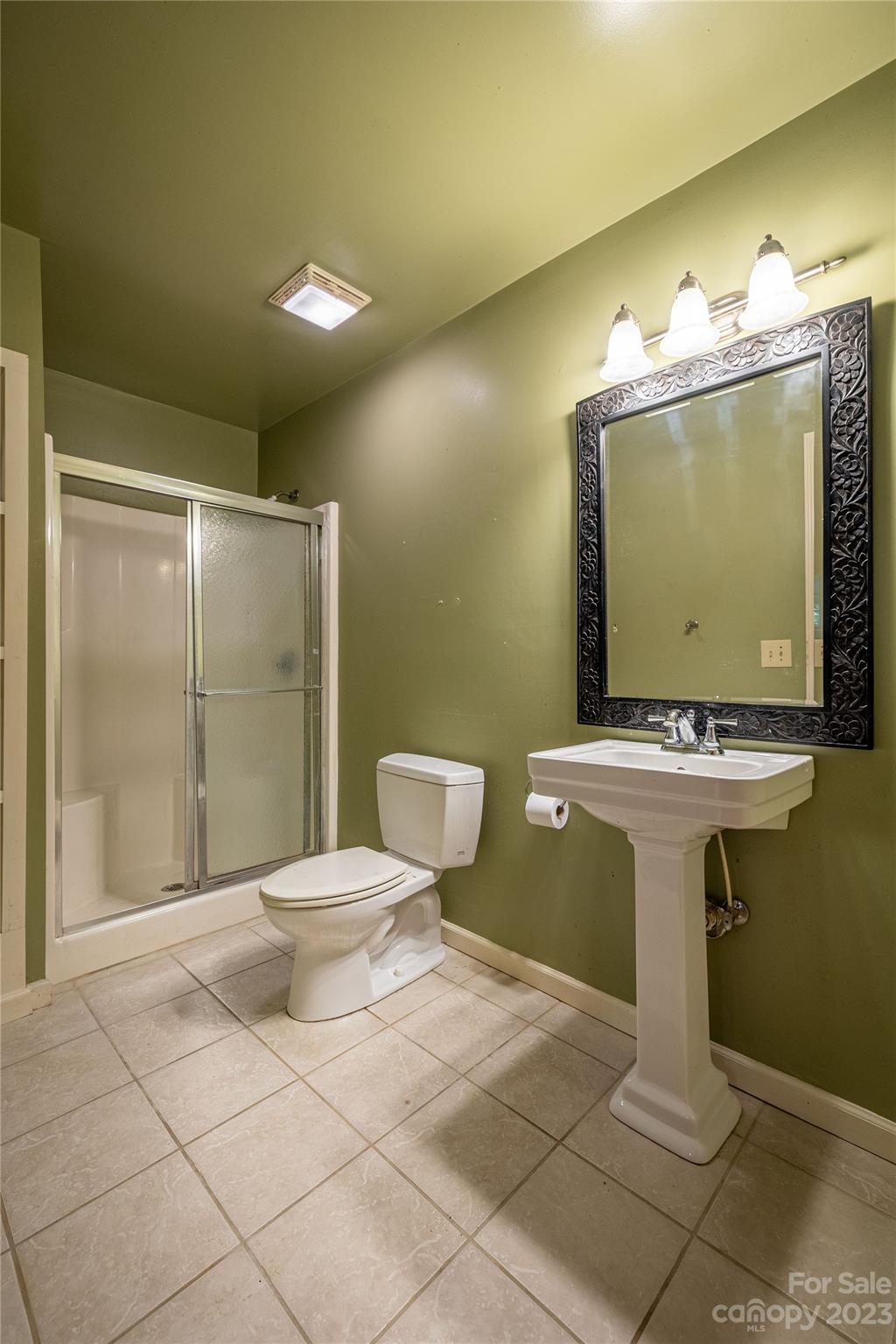 611 Vinearden Road Morganton, NC 28655 - Photo 18 of 32 a bathroom with a toilet sink and mirror