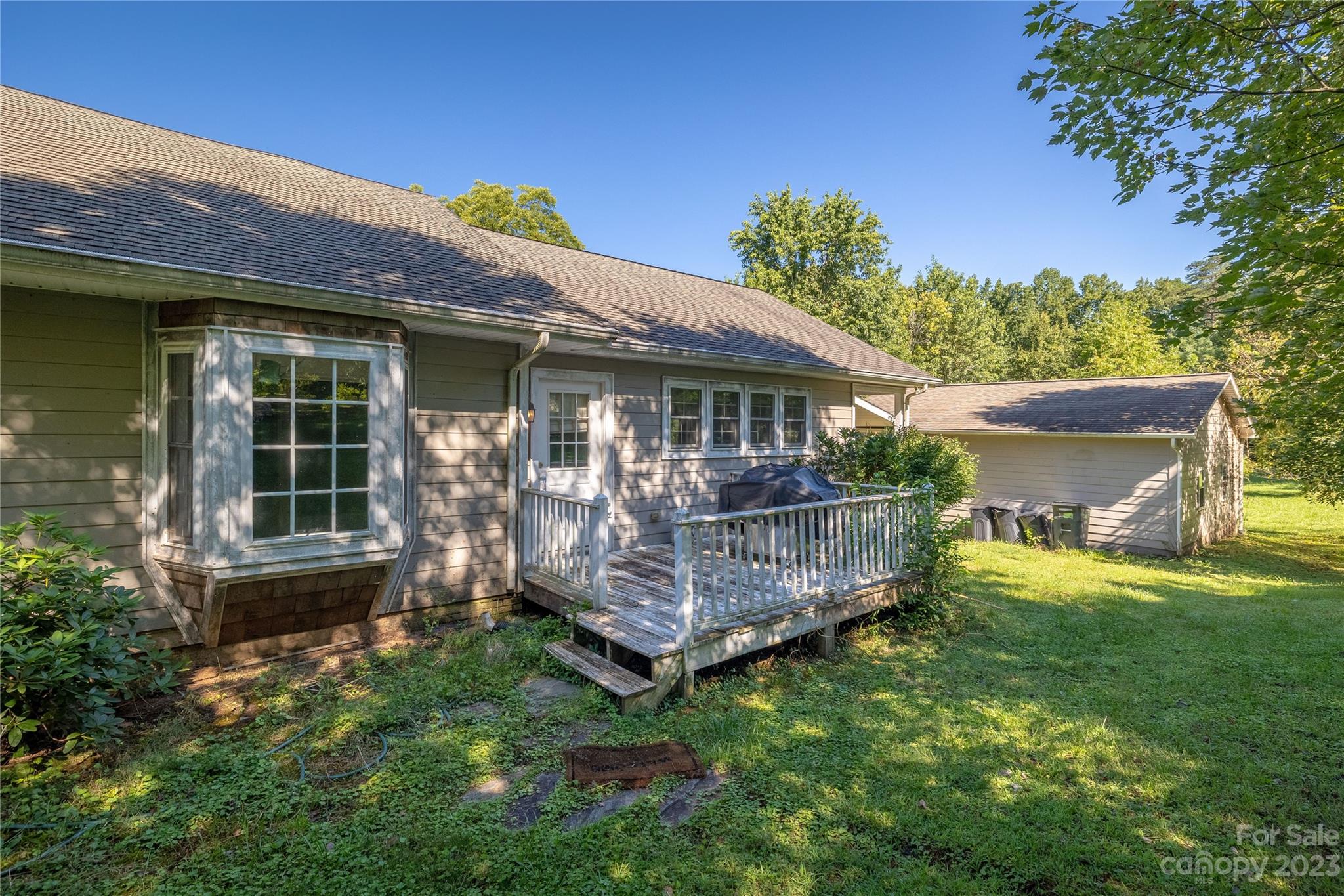 611 Vinearden Road Morganton, NC 28655 - Photo 21 of 32 a view of a house with a yard and potted plants