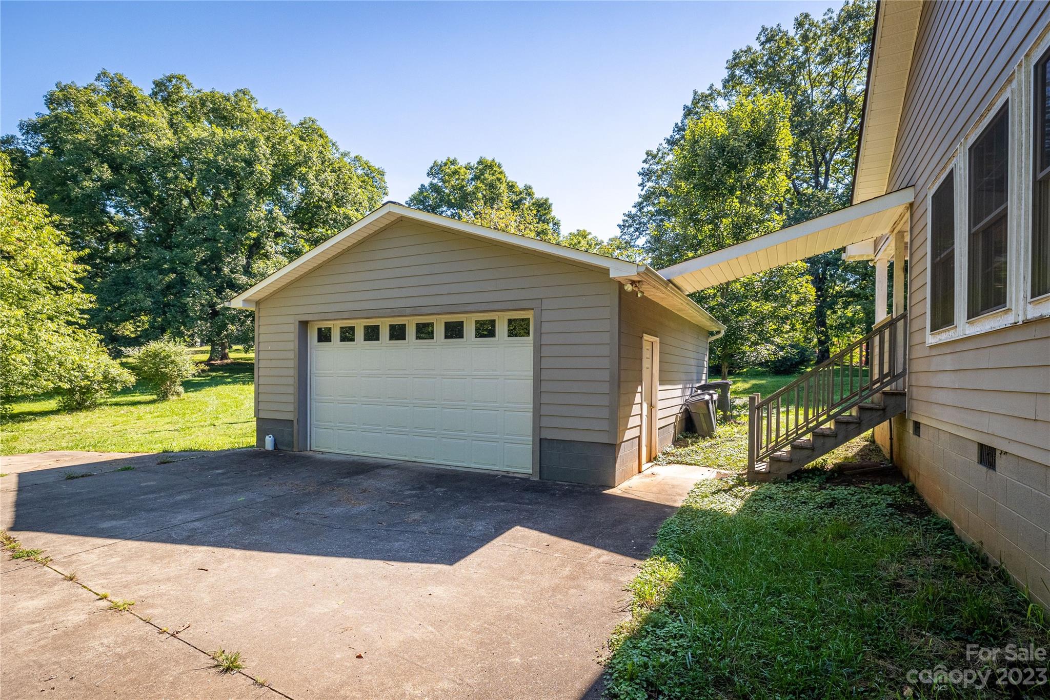 611 Vinearden Road Morganton, NC 28655 - Photo 23 of 32 a front view of a house with a yard and garage