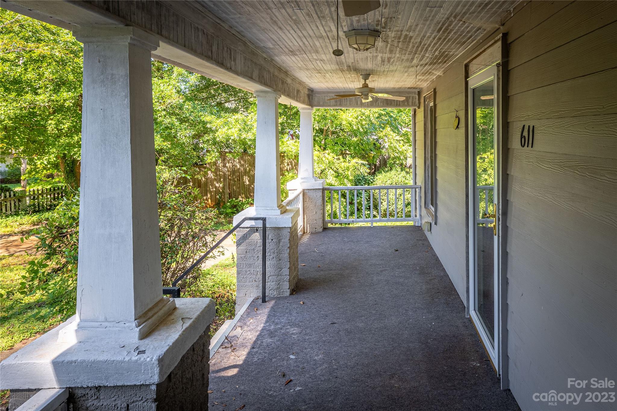 611 Vinearden Road Morganton, NC 28655 - Photo 4 of 32 a view of a porch with wooden floor and outdoor space