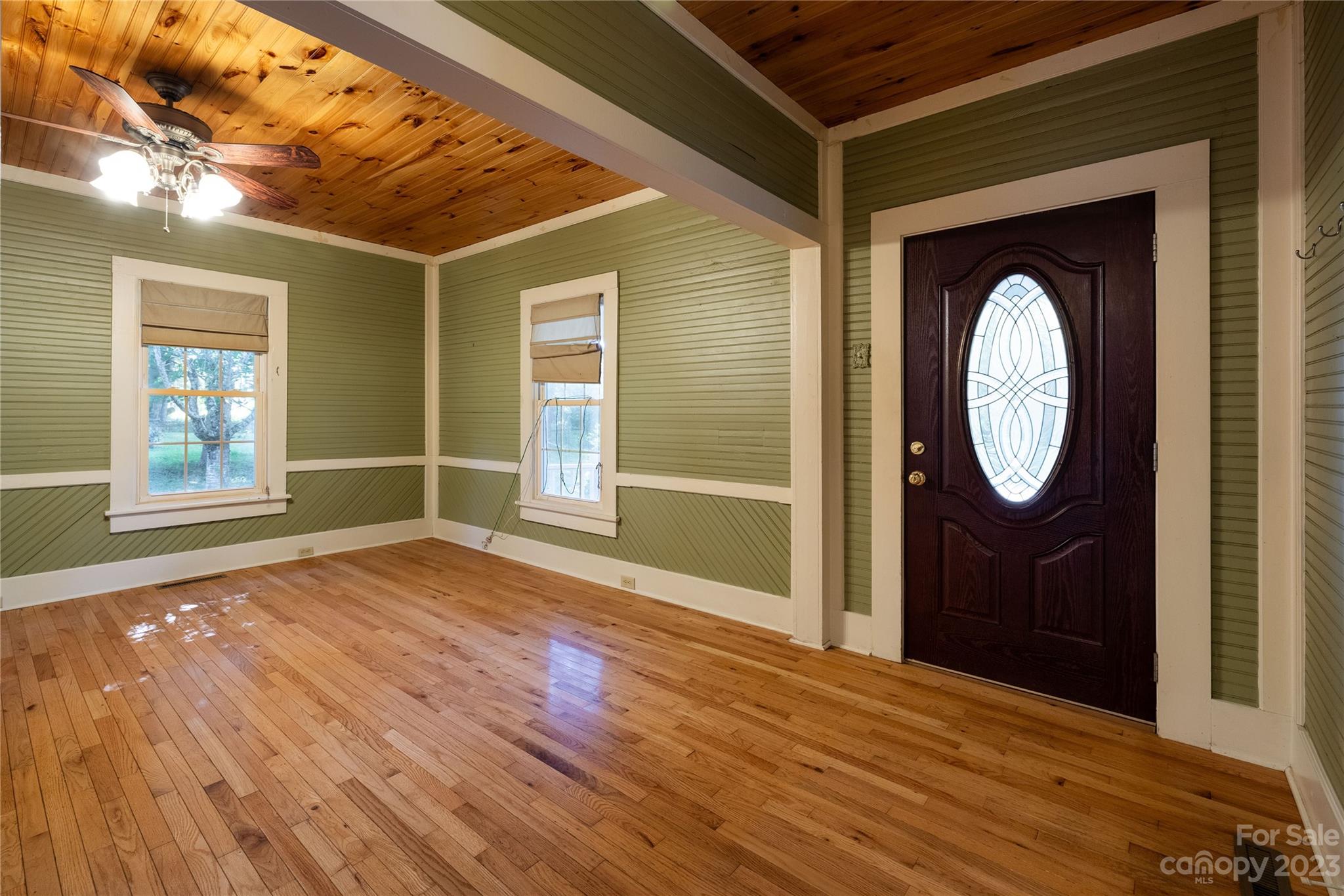 611 Vinearden Road Morganton, NC 28655 - Photo 5 of 32 a view of a livingroom with wooden floor and window