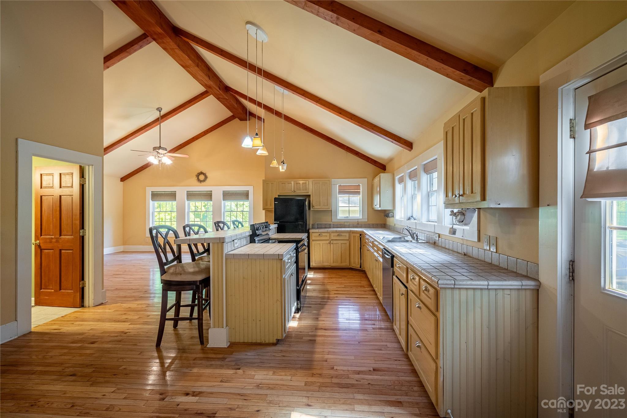 611 Vinearden Road Morganton, NC 28655 - Photo 9 of 32 a dining room with furniture and wooden floor