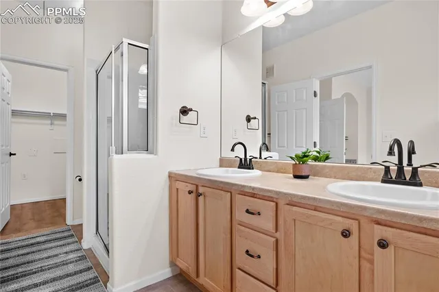 a bath room with a sink and a mirror