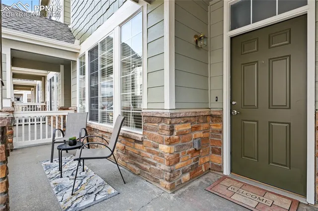 a view of a balcony with chairs