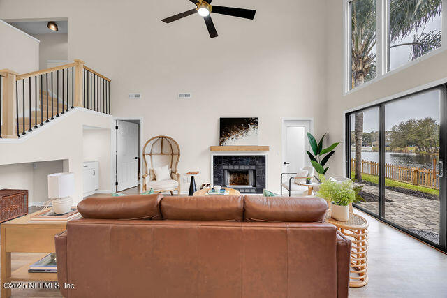2191 Birch Bark Drive Jacksonville, FL 32246 - Photo 11 of 49 a living room with furniture and a large window