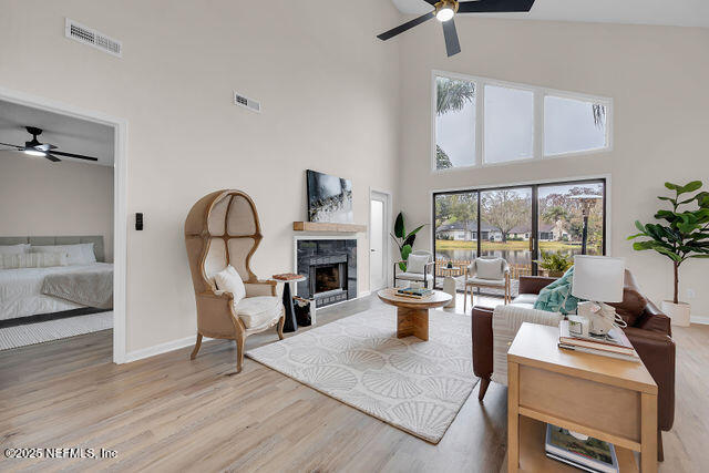 2191 Birch Bark Drive Jacksonville, FL 32246 - Photo 12 of 49 a living room with furniture a fireplace and a large window