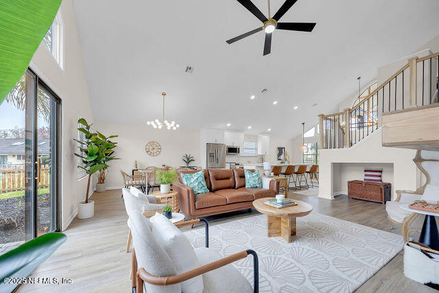2191 Birch Bark Drive Jacksonville, FL 32246 - Photo 15 of 49 a living room with furniture a fireplace and a potted plant