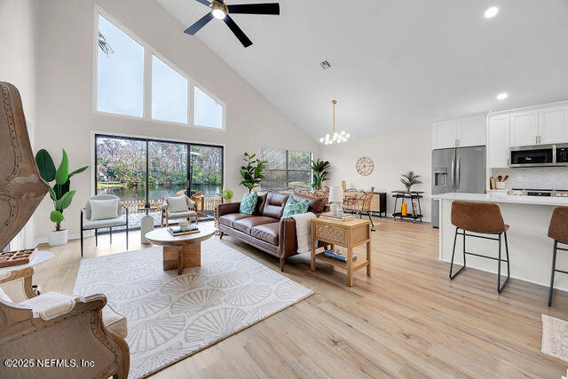 2191 Birch Bark Drive Jacksonville, FL 32246 - Photo 18 of 49 a living room with furniture a rug and a large window