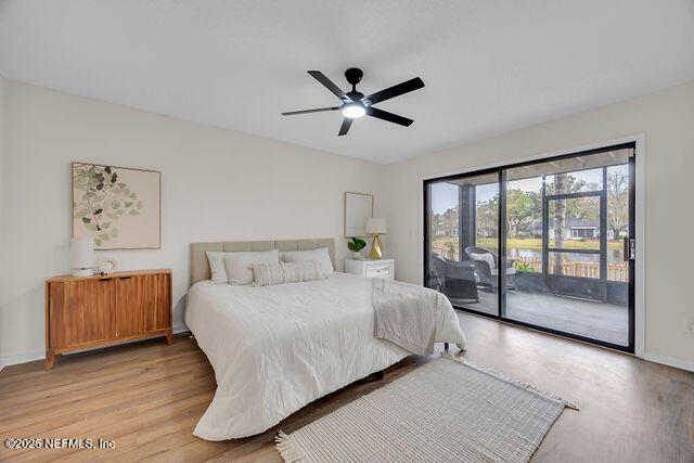 2191 Birch Bark Drive Jacksonville, FL 32246 - Photo 20 of 49 a bedroom with a large bed and a large window