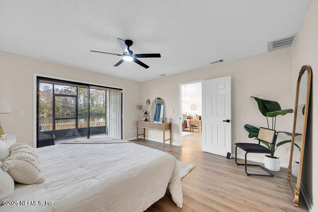 2191 Birch Bark Drive Jacksonville, FL 32246 - Photo 23 of 49 a bedroom with a bed and a chandelier