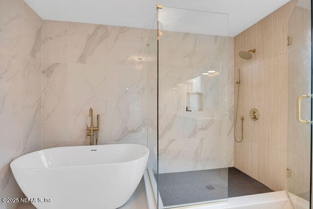 2191 Birch Bark Drive Jacksonville, FL 32246 - Photo 25 of 49 a bathroom with a bathtub and shower