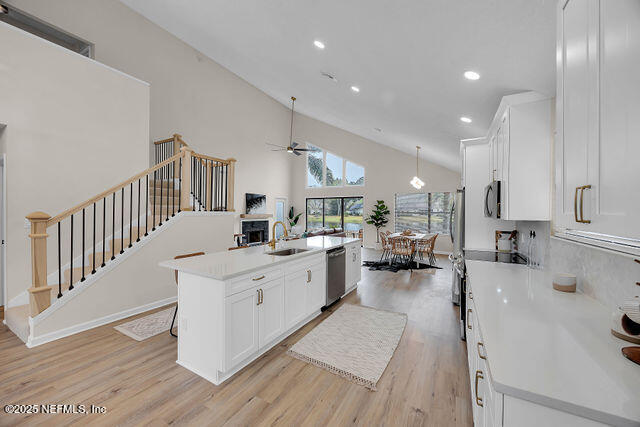 2191 Birch Bark Drive Jacksonville, FL 32246 - Photo 3 of 49 a large white kitchen with lots of counter top space and furniture
